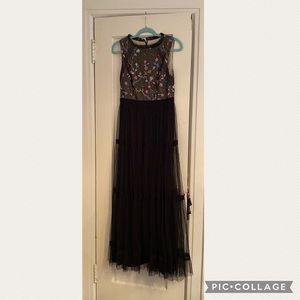 Adrianna Papell sleeveless gown- flower stitched upper and black tulle bottom.